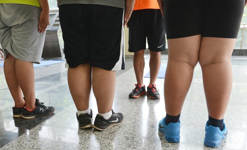 Obese young Chinese students stand in line during an exercise at a summer camp in Zhengzhou city, central China's Henan province, 14 July 2015.

Summer camps for helping obese children lose weight are held across China though many parts of the country are scorched by heat waves. Obesity is a troublesome headache for China as a growing number of adults and children are facing overweight due to unhealthy diets and lack of exercises. "The obesity rate among adults was 11.9 percent in 2012, a rise of 67.6 percent from 2002, and 6.4 percent among children and adolescents, a rate tripling that of 2002", said a statement issued by the National Health and Family Planning Commission (NHFPC).