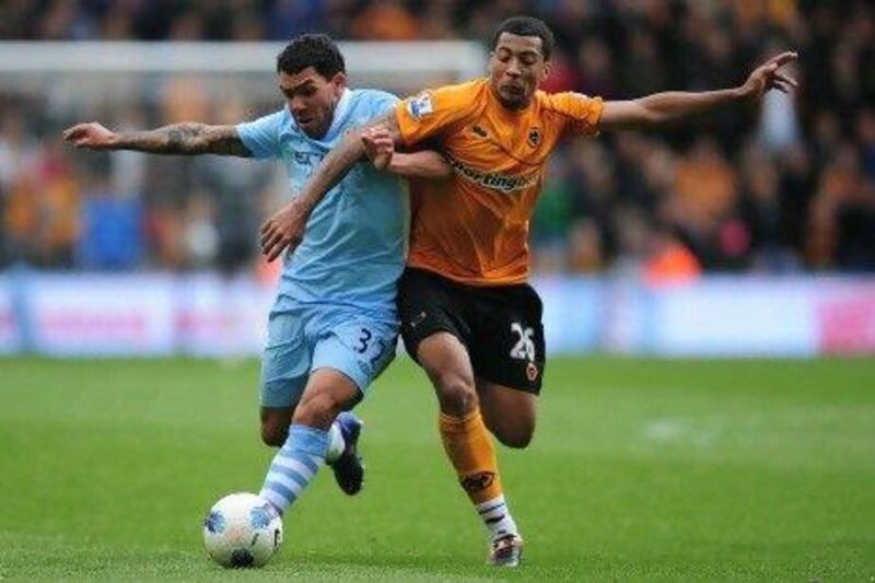 Carlos Tevez, left, missed most of the season for Manchester City before returning to net four times in his last three games. Jamie McDonald / Getty Images