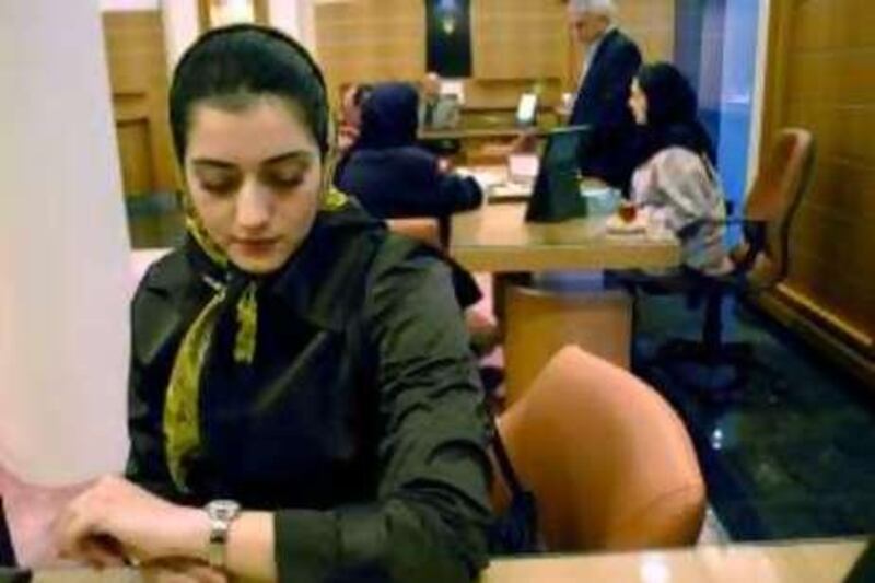                                 Tehrani woman checking a Rolex at a shopping center in northern Tehran

 *** Local Caption ***  DSC_0041.JPG