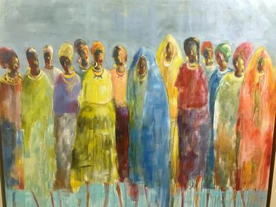 A painting by Almogera Abdulbagey shows female protesters during the uprising that toppled dictator Omar Al Bashir in April last year. Hamza Hendawi for The National