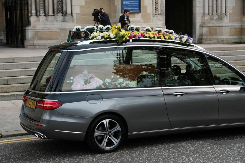 The hearse carrying the body of journalist Lyra McKee. PA via AP