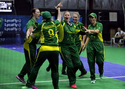 Australia players celebrate after scoring a point against South Africa during the women's final match at the Indoor Cricket World Cup, Saturday, Sept. 23, 2017, in Dubai, United Arab Emirates. (AP Photo/Kamran Jebreili)