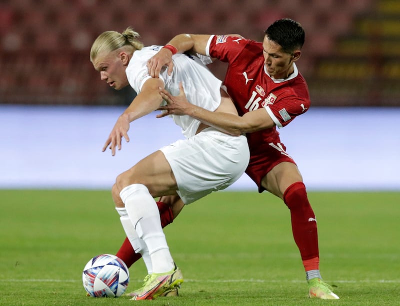 Norway's Erling Haaland (L) in action against Serbia's Sasa Lukic (R) during the UEFA Nations League soccer match between Serbia and Norway in Belgrade, Serbia, 02 June 2022.   EPA / ANDREJ CUKIC