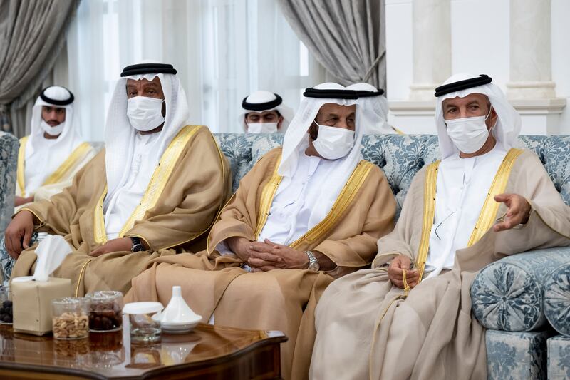  Sheikh Saeed bin Mohamed Al Nahyan, left, Abdullah Saleh bin Baowah, centre, and other sheikhs and officials follow proceedings at the Eid Al Fitr reception. Photo: Abdulla Al Neyadi for the Ministry of Presidential Affairs