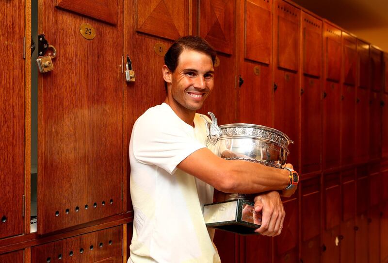 PARIS, FRANCE - JUNE 09: Rafael Nadal of Spain celebrates in the locker room with the winners trophy following the mens singles final against Dominic Thiem of Austria during Day fifteen of the 2019 French Open at Roland Garros on June 09, 2019 in Paris, France. (Photo by Clive Brunskill/Getty Images)