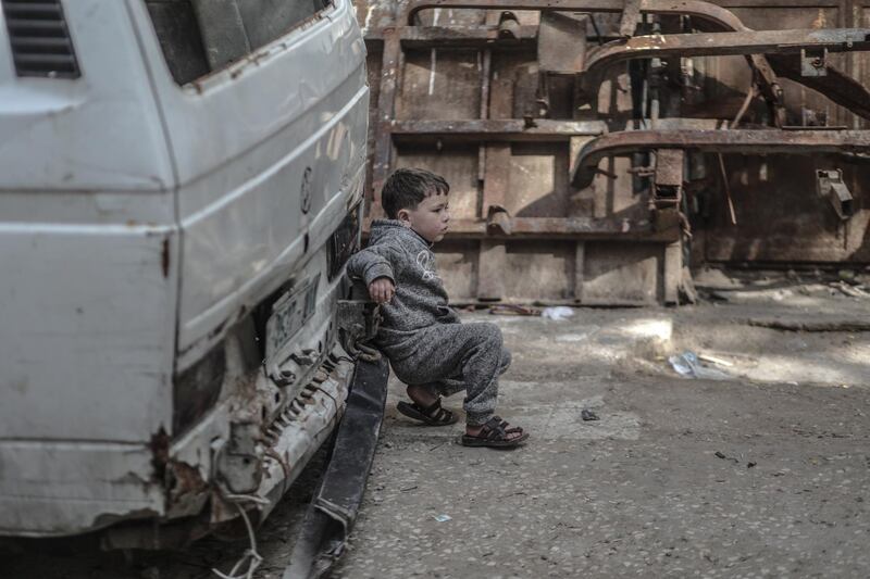 A Palestinian boy watch the funeral of Amel al-Tramse in al-Sheikh Redwan neighborhood, north Gaza City.  Amel was shot dead yesterday during clashes between Israeli troop and Palestinians protesters near the border of east Gaza City.  EPA