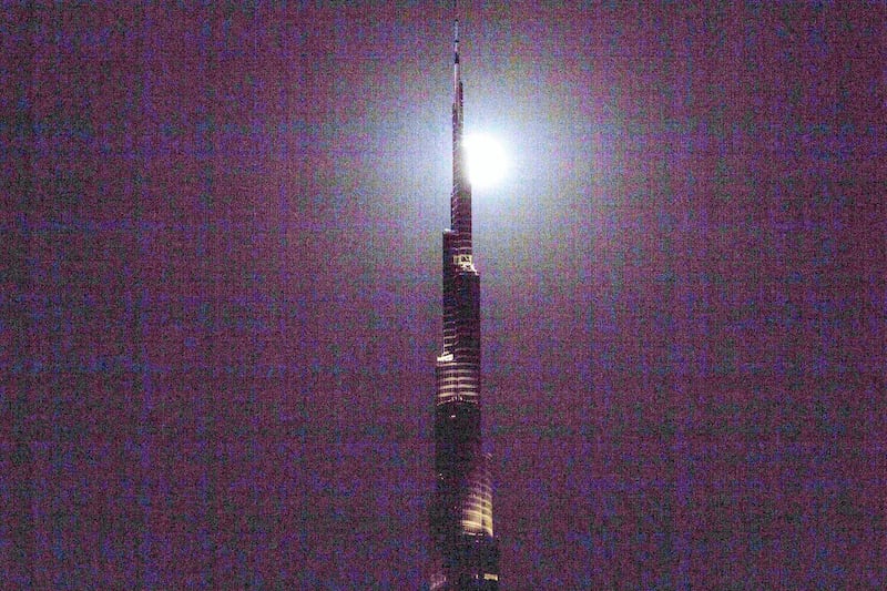 Dubai, United Arab Emirates, August 7, 2017:    A full moon rises above the Burj Khalifa in the Emaar Square area of Dubai on August 7, 2017. Christopher Pike / The NationalReporter:  N/ASection: News