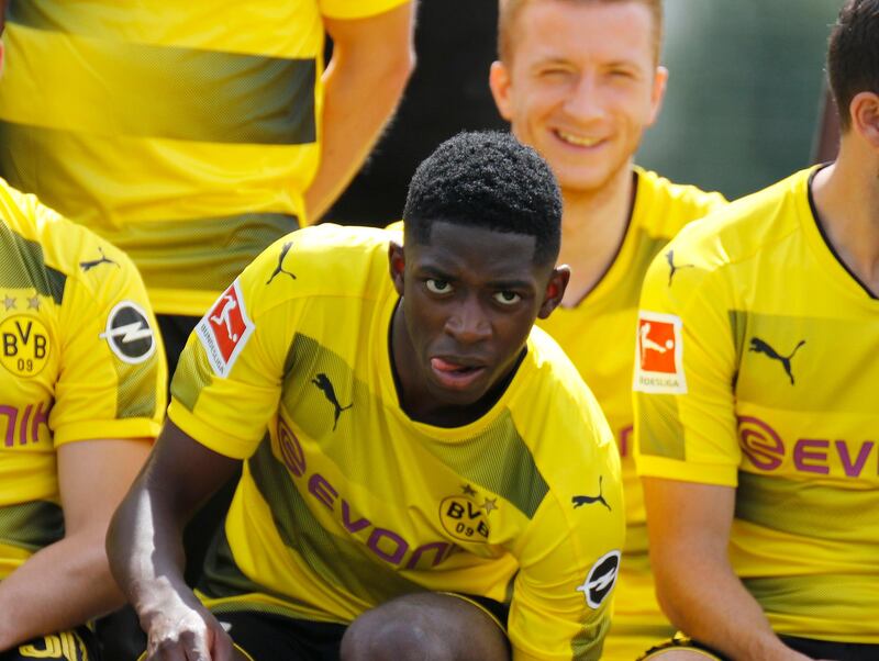 epa06133609 Ousmane Dembele (C) of Borussia Dortmund reacts during the Borussia Dortmund's team photo in Dortmund, Germany, 09 August 2017.  EPA/LEON KUEGELER