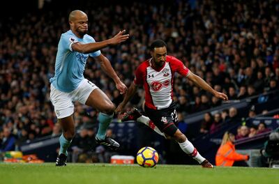 Soccer Football - Premier League - Manchester City vs Southampton - Etihad Stadium, Manchester, Britain - November 29, 2017   Manchester City's Vincent Kompany in action with Southampton's Nathan Redmond       REUTERS/Andrew Yates    EDITORIAL USE ONLY. No use with unauthorized audio, video, data, fixture lists, club/league logos or "live" services. Online in-match use limited to 75 images, no video emulation. No use in betting, games or single club/league/player publications. Please contact your account representative for further details.