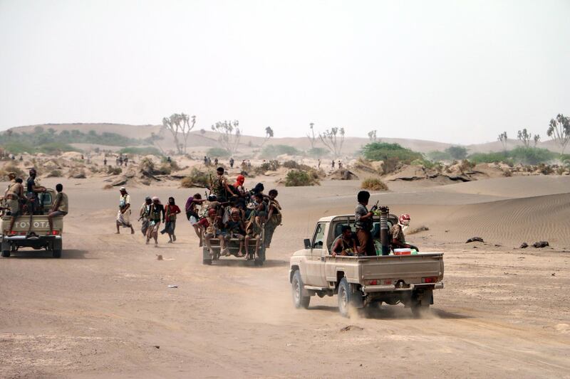 epa06847536 Yemeni government forces backed by the Saudi-led coalition take position during an attack on the port city of Hodeidah, on the outskirts of Hodeidah, Yemen, 27 June 2018 (Issued 28 June 2018). According to reports, Yemeni government forces backed by the Saudi-led coalition have made major gains south of Hodeidah during a military offensive to regain control of the Red Sea port-city that acts as an entrance point for Houthi rebel supplies and humanitarian aid.  EPA/NAJEEB ALMAHBOOBI