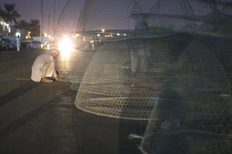 Fishermen around the Mina Fish Market. Abu Dhabi, United Arab Emirates. Mona Al Marzooqi / The National