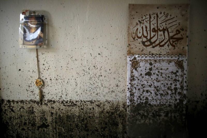 Mud is splattered across a wall in the flood-damaged home of the Kovacevic family in Topcic Polje. More than 50 people were killed by flooding and landslides in Serbia, Bosnia and Croatia. The heaviest rainfall in more than a century had caused rivers to burst their banks, sweeping away roads, bridges and homes. Dado Ruvic / Reuters