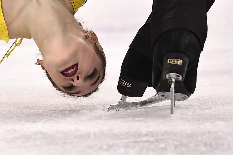 Russia's Kristina Astakhova and Russia's Alexey Rogonov compete in the pair skating free skating of the figure skating event. Aris Messinis / AFP