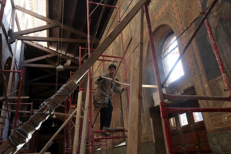 Egyptian labourers on December 17, 2016 work on the restoration of the Coptic Christian cathedral complex after a bomb attack in Cairo, Egypt. Restoration work on the St. Peter and St. Paul Coptic Orthodox Church started after 25 people were killed and 35 injured on December 11, 2016 in an explosion inside a chapel by the cathedral in the Abbassia neighborhood.  Khaled Elfiqi / EPA