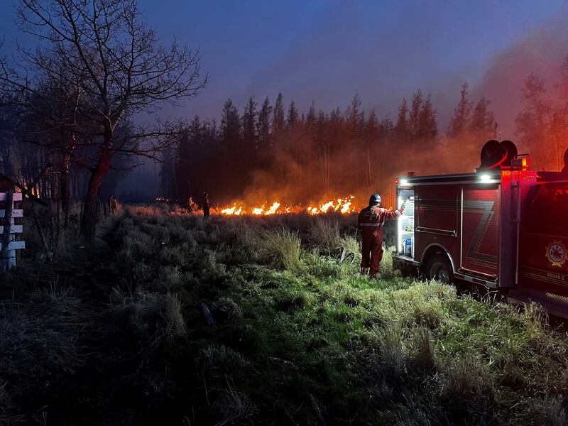 Firefighters battle a blaze in Alberta as scores of wildfires burn across several Canadian provinces. EPA