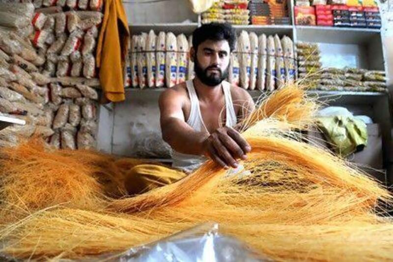 A Pakistani vendor packs vermicelli a traditional food cooked in sweet milk, ahead of Eid al-Fitr festival marking the end of Ramadan, in Peshawar, Pakistan.