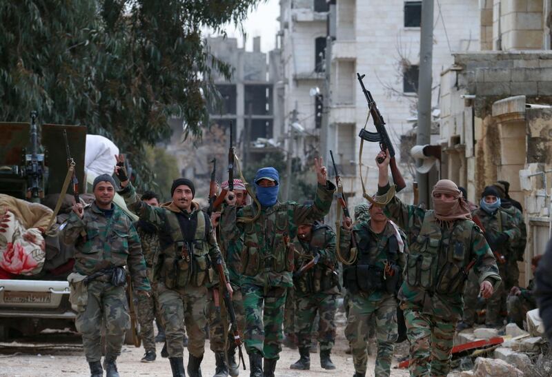 Members of the Syrian army deploy in the Al Rashidin 1 district in south-western Aleppo province.  AFP