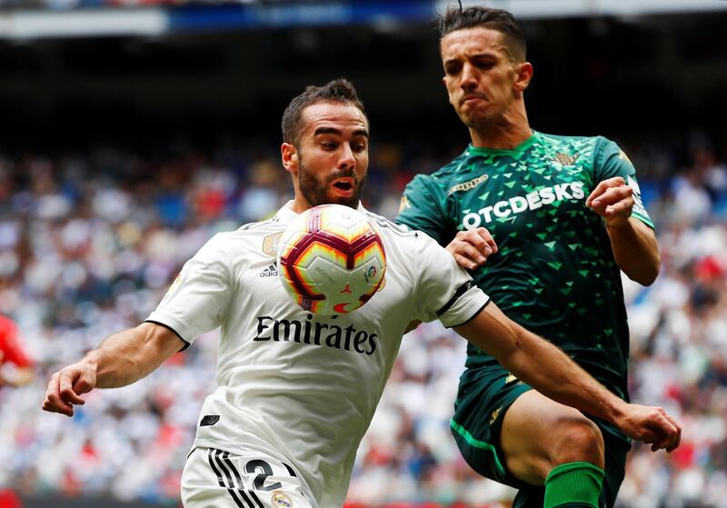 Real Madrid's Dani Carvajal in action with Real Betis' Zouhair Feddal. Reuters