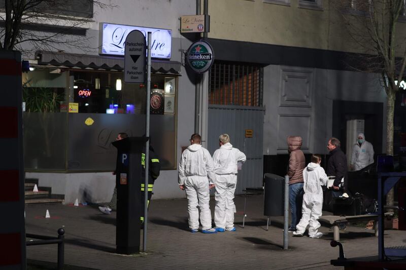 Police and Forensic police investigate the scene of a shooting in Hanau, western Germany. AFP
