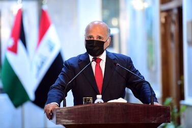 Iraqi Foreign Minister Fuad Hussein wears a protective mask during a a press conference with his Jordanian counterpart in Baghdad, Iraq, 24 June 2020. EPA