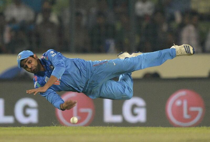 India’s Rohit Sharma throws a ball back to the field during the ICC World Twenty20 final between India and Sri Lanka at the Sher-e-Bangla National Cricket Stadium in Dhaka on April 6, 2014. Munir uz Zaman / AFP