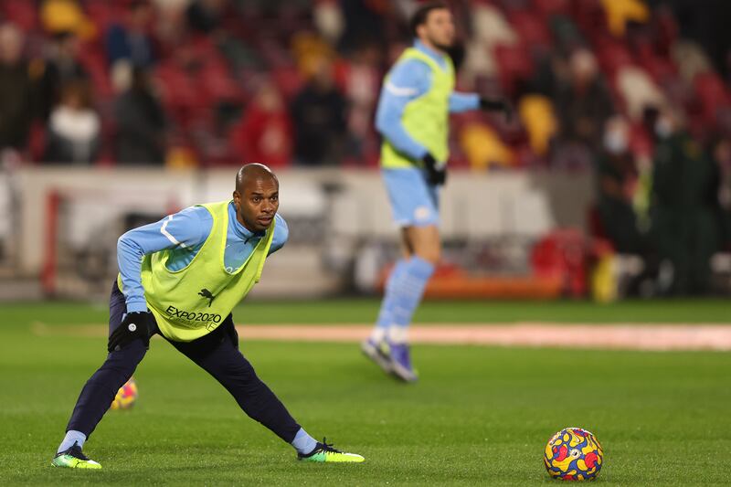 Manchester City's Fernandinho stretches as he warms-up before the match against Brentford. AP Photo 