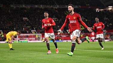 Manchester United's Portuguese midfielder #08 Bruno Fernandes celebrates scoring the team's third goal during the English Premier League football match between Manchester United and Sheffield United at Old Trafford in Manchester, north west England, on April 24, 2024.  (Photo by Oli SCARFF / AFP) / RESTRICTED TO EDITORIAL USE.  No use with unauthorized audio, video, data, fixture lists, club/league logos or 'live' services.  Online in-match use limited to 120 images.  An additional 40 images may be used in extra time.  No video emulation.  Social media in-match use limited to 120 images.  An additional 40 images may be used in extra time.  No use in betting publications, games or single club/league/player publications.   /  