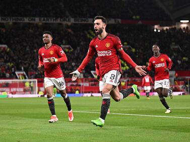 Manchester United's Portuguese midfielder #08 Bruno Fernandes celebrates scoring the team's third goal during the English Premier League football match between Manchester United and Sheffield United at Old Trafford in Manchester, north west England, on April 24, 2024.  (Photo by Oli SCARFF / AFP) / RESTRICTED TO EDITORIAL USE.  No use with unauthorized audio, video, data, fixture lists, club/league logos or 'live' services.  Online in-match use limited to 120 images.  An additional 40 images may be used in extra time.  No video emulation.  Social media in-match use limited to 120 images.  An additional 40 images may be used in extra time.  No use in betting publications, games or single club/league/player publications.   /  