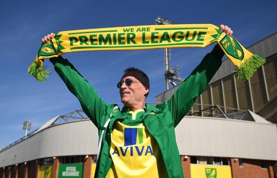 A Norwich City fan celebrates outside Carrow Road after they were promoted to the Premier League. Picture date: Saturday April 17, 2021. PA Photo. See PA story SOCCER Norwich. Photo credit should read: Joe Giddens/PA Wire. 

RESTRICTIONS: EDITORIAL USE ONLY No use with unauthorised audio, video, data, fixture lists, club/league logos or "live" services. Online in-match use limited to 120 images, no video emulation. No use in betting, games or single club/league/player publications.