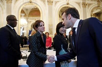 FILE PHOTO: French President Emmanuel Macron greets British actor Emma Watson as he arrives for a meeting for Gender Equality at the Elysee Palace, in Paris, France February 19, 2019. Yoan Valat/Pool via REUTERS/File Photo