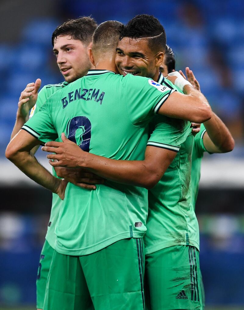 Casemiro  celebrates with his teammate Karim Benzema after scoring. Getty