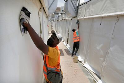Sudanese workers disinfect tents in Mina, in July 2021. AP