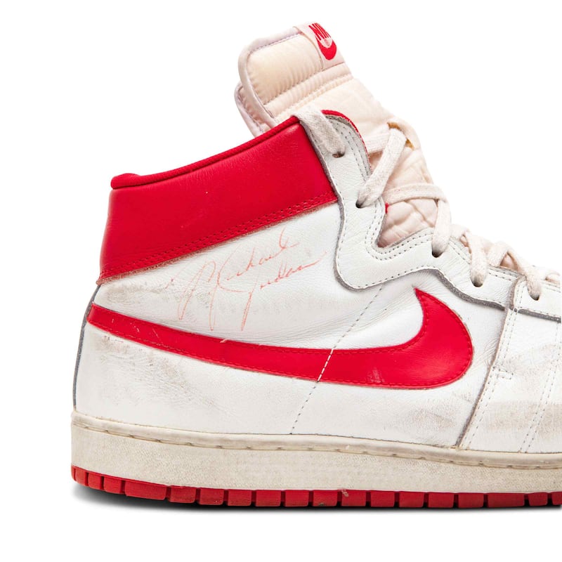 An American collector has paid more than $1.4 million for the pair of trainers worn by basketball superstar Michael Jordan early in his career, setting a record price at auction for game-worn footwear. Photo: Sotheby's