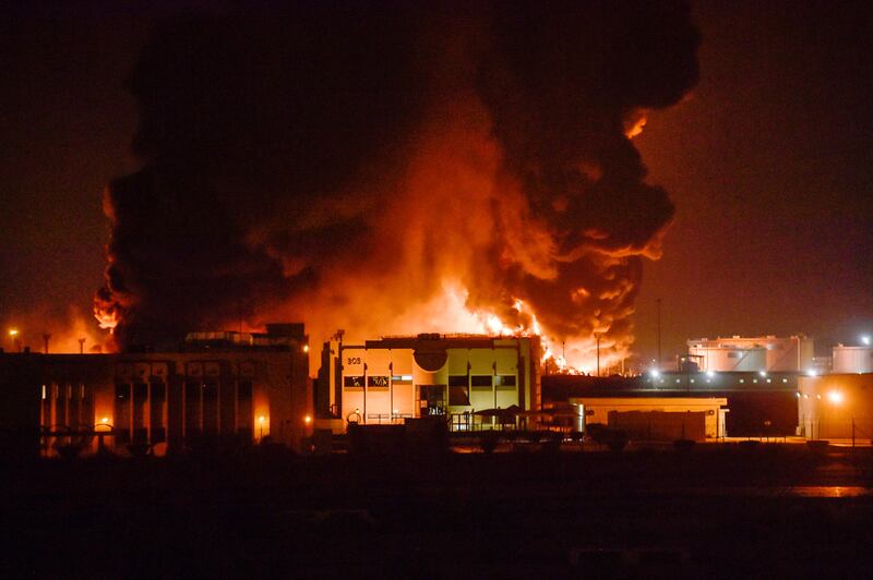 Smoke and flames rise above Saudi Arabia's Red Sea coastal city of Jeddah following a Houthi attack on an Aramco oil facility. AFP