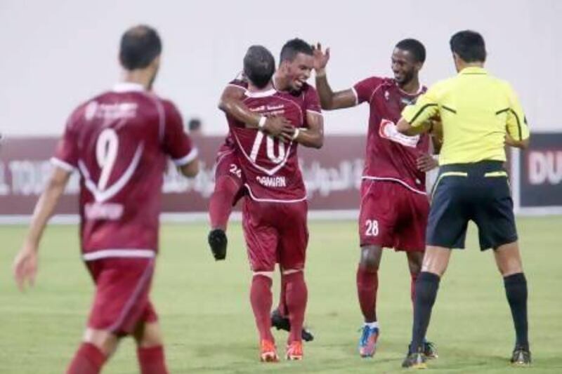 Al Wahda’s Mahmoud Khamis celebrates with teammate Damian Diaz after scoring during a friendly against the Kuwait Olympic team in Abu Dhabi at the end of last month.