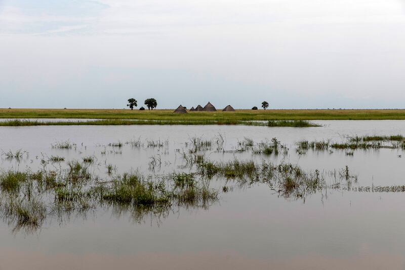 Tukuls – local huts made of mud and grass – surrounded by water near Malualkon. The UN says flooding has affected almost a half-million people across South Sudan since May.