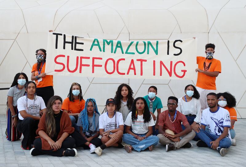 Young activists protest about smog being created by deforestation in the Amazon, on day six of Cop28 at Expo City Dubai. Chris Whiteoak / The National