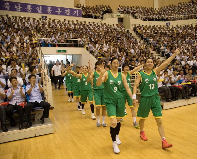 The players arrive at the clash which took place at a gym in Pyongyang, North Korea. Reuters