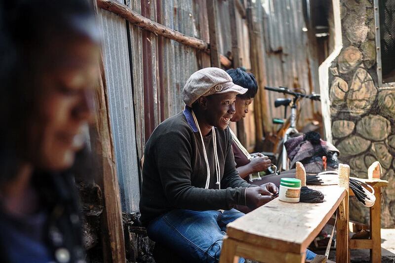 Women work  in Nairobi's Korogocho slum creating clothes and accessories for Ethical Fashion Africa. AFP 