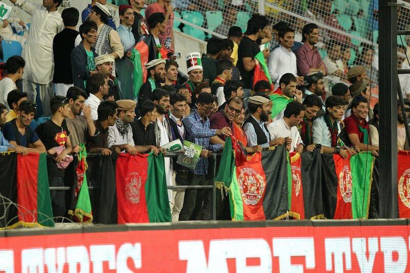 Afghanistan cricket fans watch their team in action. Afghanistan wicketkeeper Mohammad Shahzad has been banned for 12 months after inadvertently ingesting a prohibited substance, the International Cricket Council (ICC) said on Thursday. Prashant Bhoot / AFP