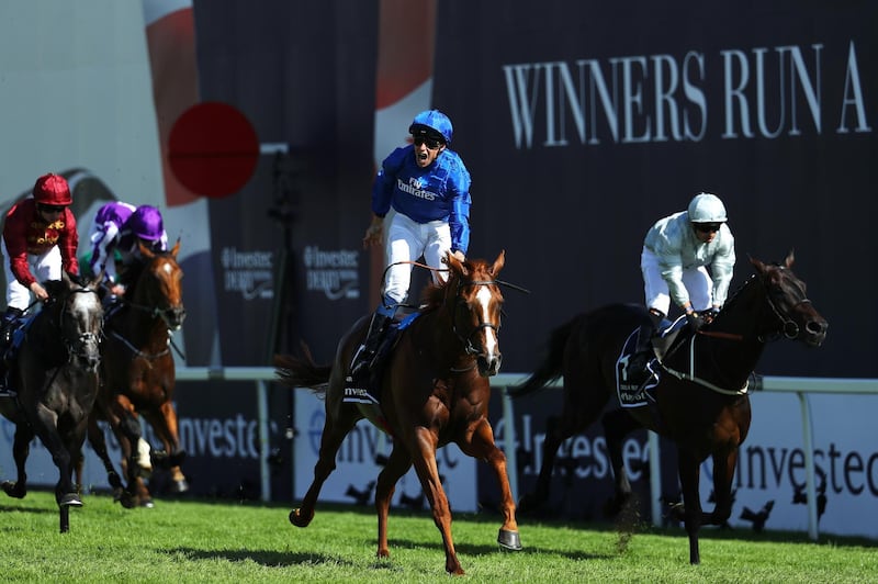 EPSOM, ENGLAND - JUNE 02:  William Buick ridding Masar celebrates crossing the line and winning the Investec Derby race on Derby Day at Epsom Downs on June 2, 2018 in Epsom, England.  (Photo by Warren Little/Getty Images)