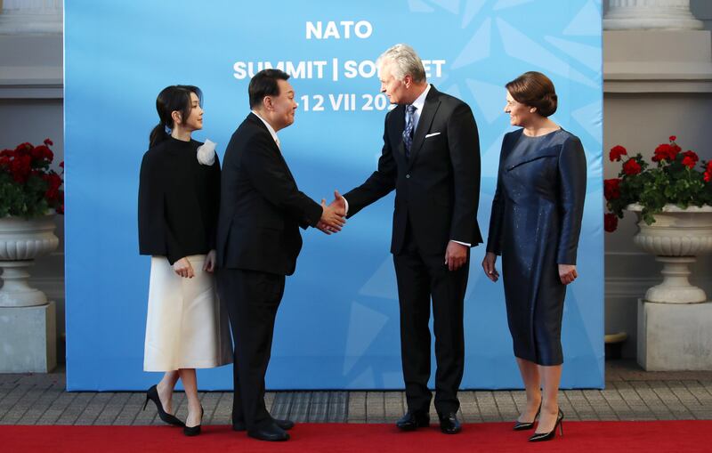 Lithuanian President Gitanas Nauseda and his wife Diana Nausediene welcome South Korean President Yoon Suk Yeol and his wife Kim Keon Hee. EPA