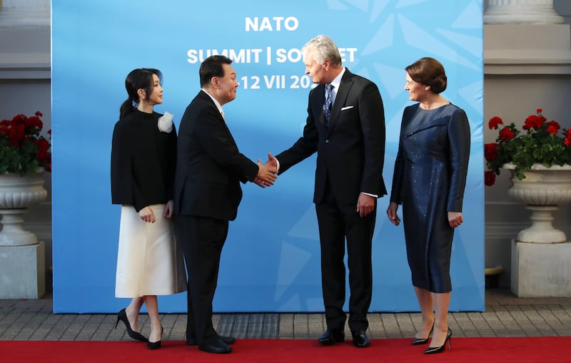 Lithuanian President Gitanas Nauseda and his wife Diana Nausediene welcome South Korean President Yoon Suk Yeol and his wife Kim Keon Hee. EPA