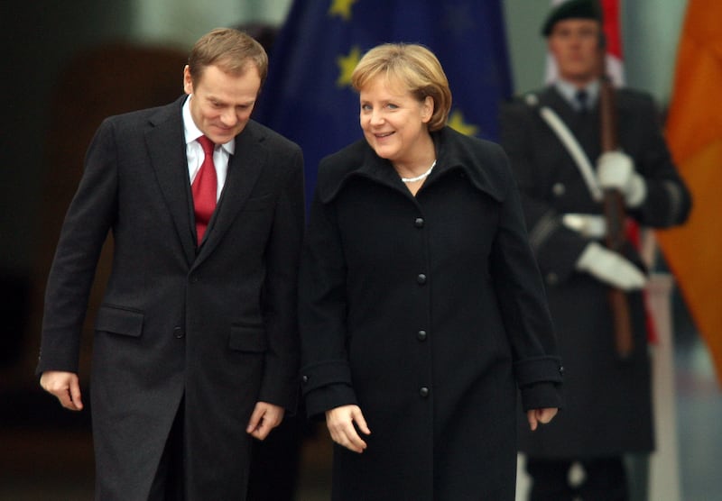 Ms Merkel and Mr Tusk chat at the Chancellery in Berlin in 2007. Getty Images
