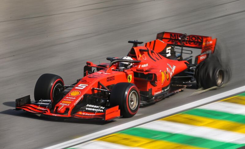 German Sebastian Vettel loses a tyre during the Brazilian Grand Prix, where the two Ferraris crashed into each other. EPA