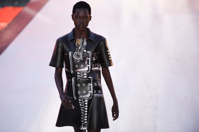 A dress printed with images of huge buckles and belts at Louis Vuitton.  AFP
