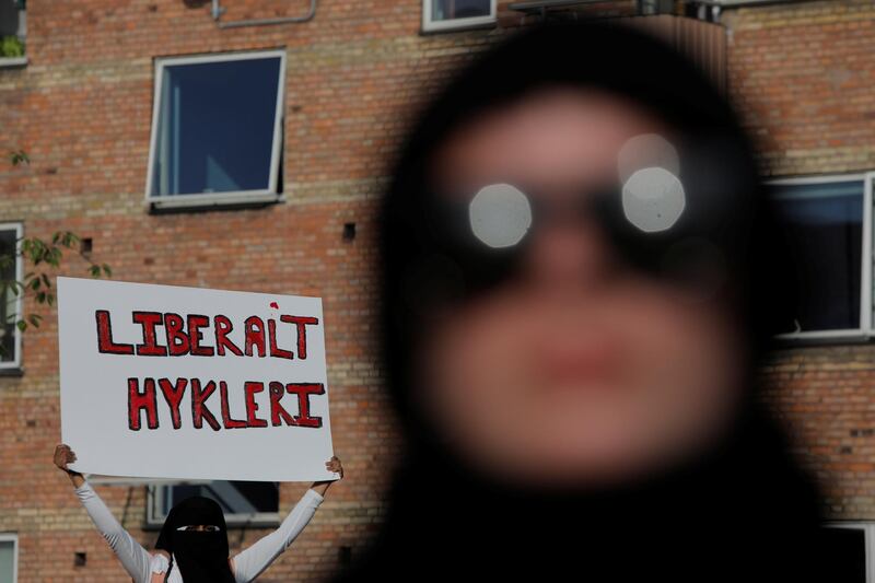 People participate in a demonstration against the Danish face veil ban. Reuters