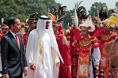 Abu Dhabi's Crown Prince Sheikh Mohammed bin Zayed Al Nahyan and Indonesian President Joko Widodo walk during a welcoming ceremony at the presidential palace in Bogor, Indonesia, July 24, 2019. Dita Alangkara/Pool via Reuters