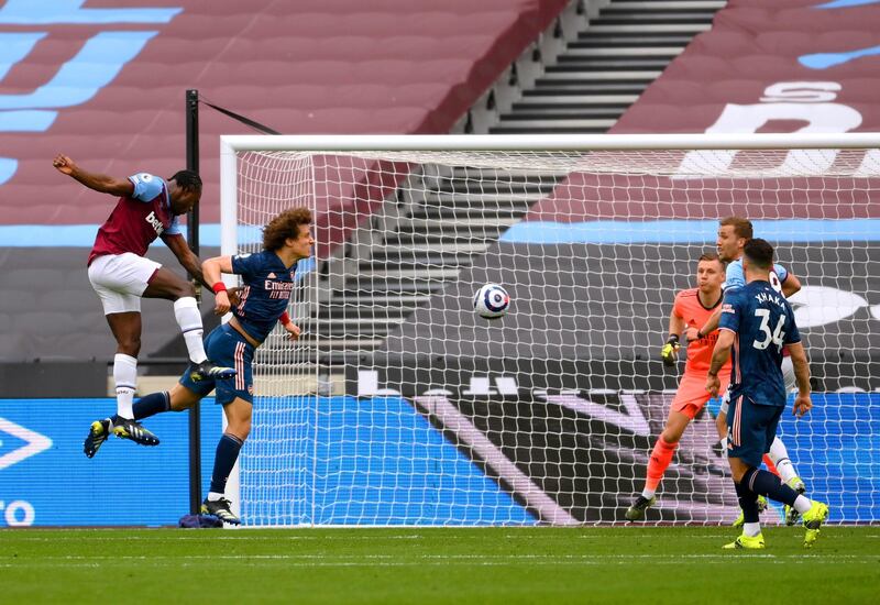 West Ham United's Michail Antonio, left, heads the ball on for teammate Tomas Soucek to score their side's third goal. PA