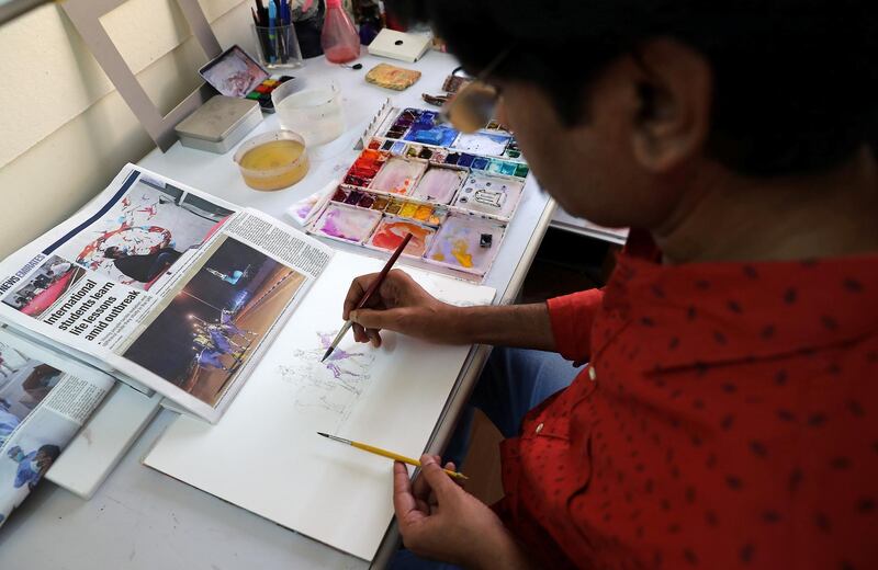 DUBAI , UNITED ARAB EMIRATES , May 14 – 2020 :- Artist Atul Panase making painting from the photo published in The National newspaper at his home studio in Deira Dubai. He is from India and based in Dubai for more than two decades. He was one of curators for World Art Dubai in 2017 and 2018. He is also the UAE Country Leader since last 5 years for the team of watercolorists for FabrianoInAcquarello and UrbinoInAcquerello international watercolor festivals which happen annually in Italy. He started the art activity  #pickanypicandpaint from the newspaper during the stay home era in the UAE because of COVID 19 pandemic. In this art activity which is trending with the hash tag #pickanypicandpaint involves more than 80 artists locally and internationally so far as the number is growing day by day. People here and also from other countries are participating and painting from the piece of newspapers. (Pawan Singh / The National) For Arts & Life/Online/Instagram.  Story by Katy Gillett